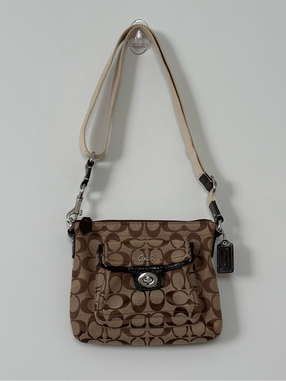 Coach Penelope Signature Jacquard Turnlock Crossbody Swingpack Bag Brown